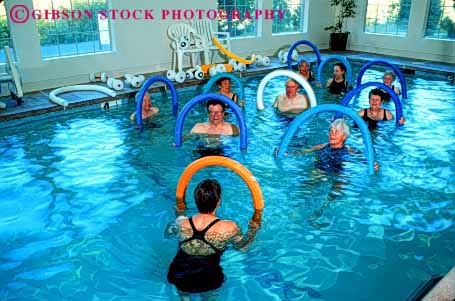 Stock Photo #2380: keywords -  aerobic aerobics class classes conditioning elderly exercise exercising female fit fitness group health horz male mature men old older people person pool released senior seniors sixties strength stretch swim swimming training trim water wellness women workout