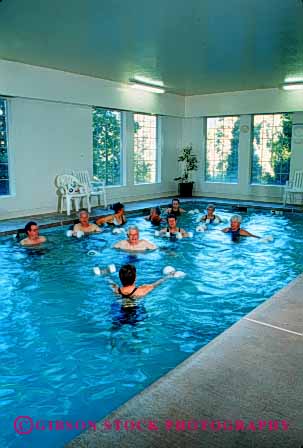 Stock Photo #2381: keywords -  class conditioning elderly exercise female fit fitness health male mature men old pool released senior sixties strength stretch swim training trim vert water wellness women workout