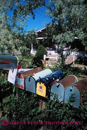 Stock Photo #2383: keywords - box boxes communicate deliver group letter mail mailbox mailboxes office personalized post rail row rural same sameness vert