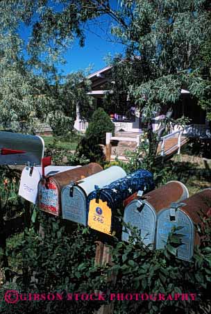 Stock Photo #2383: keywords -  box boxes communicate deliver group letter mail mailbox mailboxes office personalized post rail row rural same sameness vert