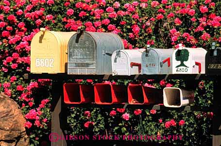 Stock Photo #2384: keywords -  box boxes communicate deliver group horz letter mail mailbox mailboxes office pattern post rail repeat row rural same sameness symmetrical