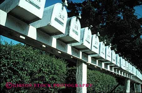 Stock Photo #2385: keywords -  box boxes communicate deliver group horz identical letter mail mailbox mailboxes office pattern post rail repeat row rural same sameness symmetrical white