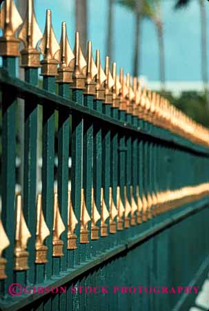 Stock Photo #2386: keywords -  bar barrier fence gold metal paint pattern row security sharp spear steel strong symmetrical vert