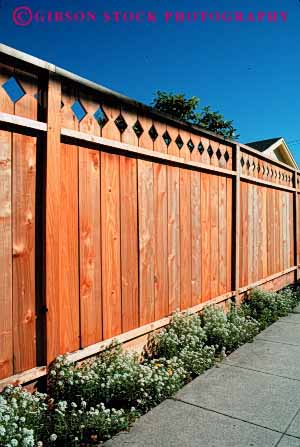 Stock Photo #2387: keywords -  barrier board fence geometric geometry landscape pattern residential row security symmetrical vert wood