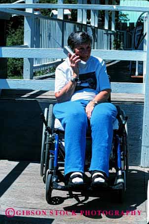 Stock Photo #2423: keywords -  chair communicate cordless disability handicapped outdoor phone relax released remote talk telephone vert wheel woman
