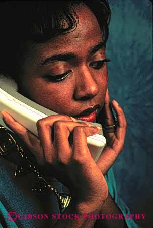 Stock Photo #2425: keywords -  african american black communicate concern cordless emotion ethnic express face female gesture intent listen minority phone released serious skin talk telephone vert woman