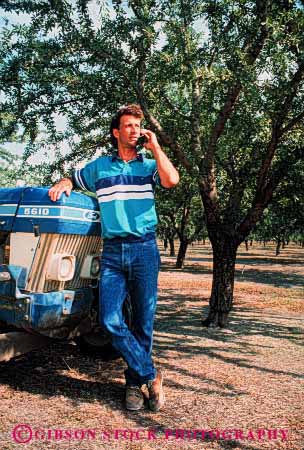 Stock Photo #2427: keywords - agriculture business casual cell cellular commerce communicate convey data electronic farm farmer field orchard people person phone phones relax released remote report talk talking talks technology telecommunication telephone telephones transfer use uses using vert work