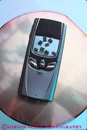 Stock Photo #11077: keywords -  accessory battery cell cellular chips communicate communications compact components cordless devise digital disk modern new parts phone powered remote semiconductor silicon technology telephone vert wafer wireless