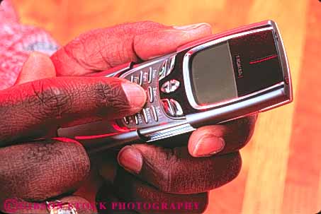 Stock Photo #11078: keywords - accessory african american battery black cell cellular communicate communications compact cordless devise dialing digital ethnic finger fingers hand hands hold holding horz man minority modern new people person phone phones portable powered remote talk talking talks technology telephone telephones use uses using wireless