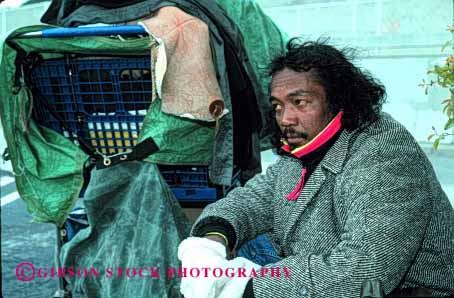 Stock Photo #2435: keywords -  african alone american black broke destitute ethnic homeless horz jobless lonely male man minority poor rejected released sad unemployed