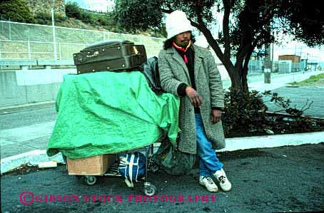 Stock Photo #2437: keywords - african alone american black broke destitute ethnic homeless horz jobless lonely male man minority poor rejected released sad unemployed