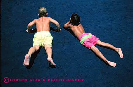 Stock Photo #2453: keywords -  boy boys child children couple friend horz not outdoor relax released skin summer sun sunbath sunburn sunshine swim tan tanning two vacation warm