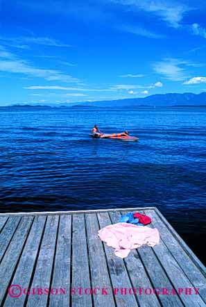 Stock Photo #2456: keywords -  adolescent boy calm couple flathead float friend girl lake montana outdoor quiet raft relax skin summer sun sunbath sunburn sunshine swim tan tanning teenagers together vacation vert warm