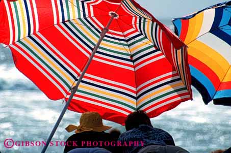 Stock Photo #2457: keywords -  beach calm couple friend horz outdoor quiet relax summer sun sunbath sunburn sunshine tan tanning together umbrella vacation warm