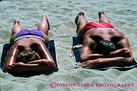 Stock Photo #2459: keywords -  beach calm couple friend horz man outdoor quiet relax skin sleep summer sun sunbath sunburn sunshine tan tanning together vacation warm woman