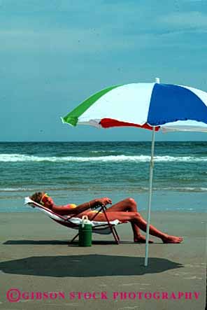 Stock Photo #2460: keywords -  alone beach calm female ocean outdoor quiet relax released skin summer sun sunbath sunburn sunshine tan tanning vacation vert warm woman