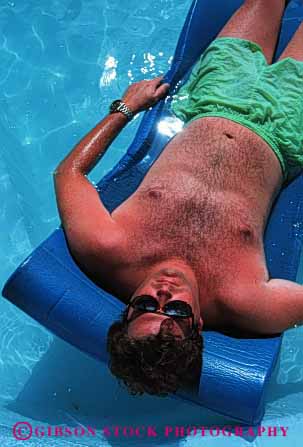 Stock Photo #2462: keywords -  alone calm float male man outdoor pink pool quiet relax released skin summer sun sunbath sunburn sunshine tan tanning vacation vert warm