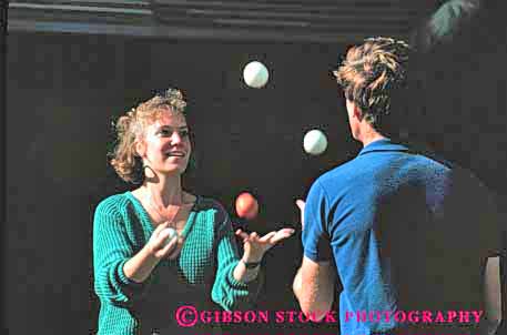 Stock Photo #2467: keywords - balls coordinate coordination couple horz juggle juggling not practice released share skill team together