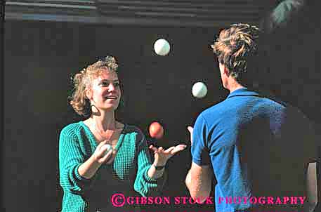 Stock Photo #2467: keywords -  balls coordinate coordination couple horz juggle juggling not practice released share skill team together