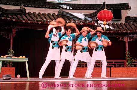 Stock Photo #2468: keywords -  asian chinese coordinate coordination ethnic hats horz juggle juggling men minority not practice released share skill team together