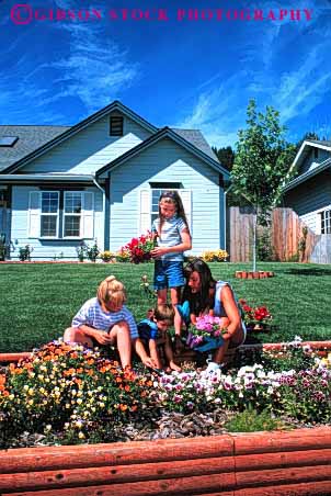 Stock Photo #2473: keywords -  child children cultivate daughter decorate family female friend garden girl grow help home house landscape mother outdoor parent plant released single sister son summer teach together vert wife woman