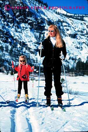 Stock Photo #2480: keywords -  child cooperate daughter family female girl learn mother nordic parent practice recreation released single ski snow sport teach team together vert wife winter woman young