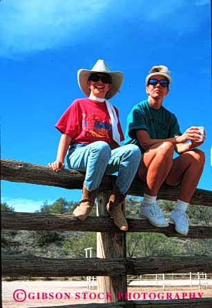 Stock Photo #2482: keywords -  child colorful daughter family female fence girl guest mother parent ranch relax released single sit summer together vert warm watch west western wife woman