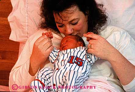 Stock Photo #2487: keywords -  affection baby bed birth boy child family female horz hospital intimate love mother newborn parent released single together wife woman