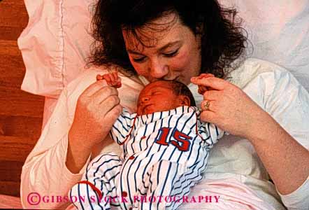 Stock Photo #2487: keywords - affection baby bed birth boy child family female horz hospital intimate love mother newborn parent released single together wife woman