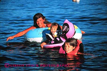 Stock Photo #2488: keywords - child children daughter family female float girl horz lake mother parent play recreation released single sister sport summer swim together vacation warm water wife woman