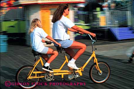 Stock Photo #2489: keywords -  balance bicycle bike child cooperate daughter family female fun girl horz mother parent play recreation released rent ride single sport summer tandem team together travel vacation warm wife woman