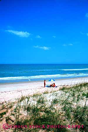 Stock Photo #6135: keywords -  alone beach boy child children daughter day enjoy florida girl landscape mom mother offspring parent play sand scenic share sibling single sky son summer sunny swim together travel trip umbrella vacation vert warm wife woman