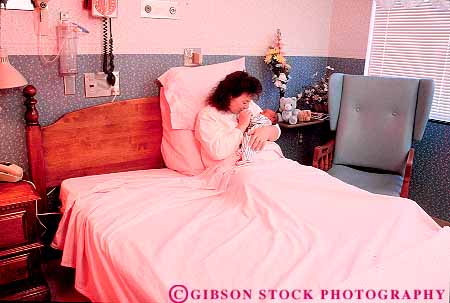 Stock Photo #17013: keywords - adult affection affectionate babies baby bed bedroom care cares caring child children cuddle cuddles cuddling female horz hospital hospitals in infant infants kid kids love loving maternity mom mother mothers newborn offspring parent parents people person playing released room rooms share shares sharing single summer tender together with woman women youth