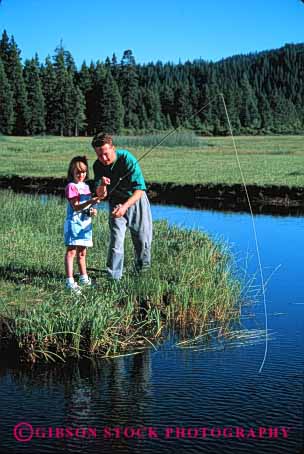 Stock Photo #2505: keywords -  child dad daughter father fish fishing girl help lake learn outdoor parent released single sport stream summer teach together vert