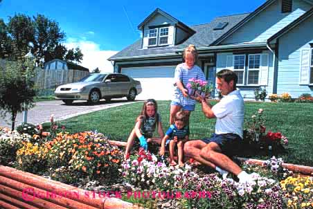 Stock Photo #2507: keywords -  child children cultivate dad decorate father garden gardening girl home horz house landscape learn outdoor parent plant released single summer teach team together