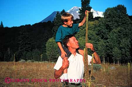 Stock Photo #2509: keywords -  boy child dad examine father horz learn nature outdoor parent plant released single son study team together