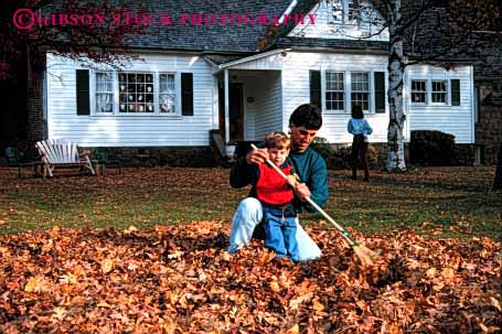 Stock Photo #2511: keywords -  assist autumn boy child chore dad effort fall father help home horz house learn leaves outdoor parent rake released son together work