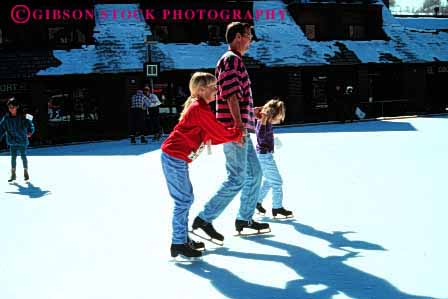 Stock Photo #2513: keywords - child children dad father girl horz ice learn outdoor parent practice released rink single skate sport sunshine team together winter