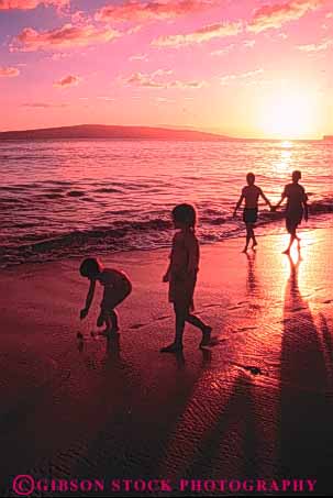 Stock Photo #3364: keywords -  beach calm child families family father hawaii husband mother ocean outdoor pink relax released security strolling sunset together tropical vacation vert warm water wife