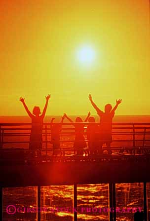 Stock Photo #2514: keywords -  arms children cruise dusk family joy orange parent released ship summer sun sunset vacation vert warm wave