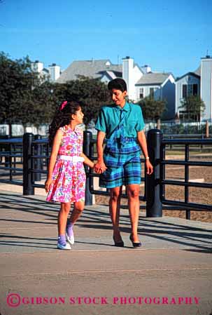 Stock Photo #2521: keywords -  children couple daughter ethnic happy hispanic mexican minority mother parent private released single talk together vert walk