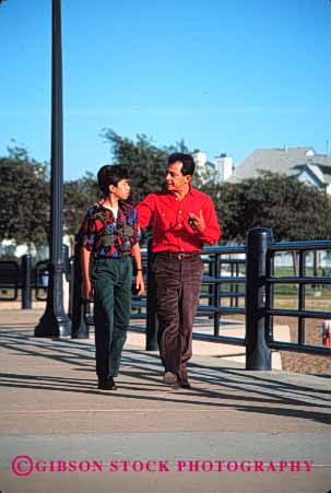 Stock Photo #2524: keywords -  children couple ethnic father happy hispanic mexican minority parent private released single son talk together vert walk