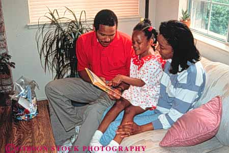 Stock Photo #3368: keywords -  african american child closeness families family father home horz husband learn love mother read released security teach together wife