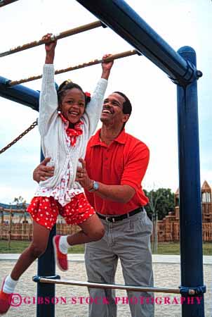 Stock Photo #2528: keywords -  african american assist black children climb daughter ethnic exercise father girl ground hang happy help house minority parent play released single summer together vert