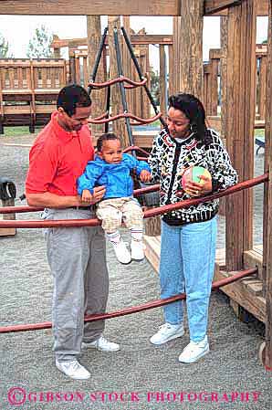 Stock Photo #2529: keywords - african american black boy child ethnic family father ground group happy minority mother only parent play released son summer together vert