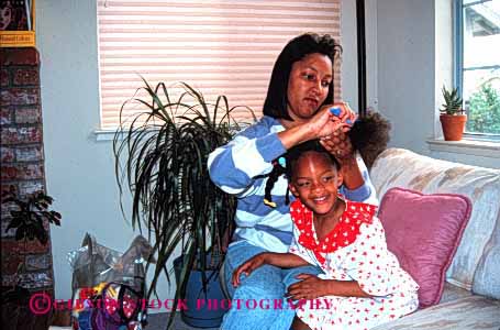 Stock Photo #2532: keywords - african american black children comb daughter ethnic group hair happy home horz house minority mother parent released sets single together