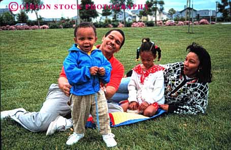 Stock Photo #2533: keywords -  african american black children daughter ethnic family father group happy horz minority mother outdoor parent picnic relax released son summer together