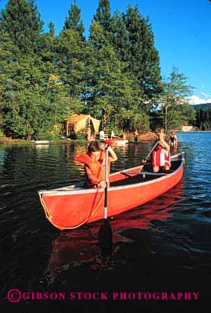 Stock Photo #2539: keywords -  boat boating boats camp camping canoe canoeing canoes child children family kid kids lake paddle recreation released safety summer together vacation vert vest water