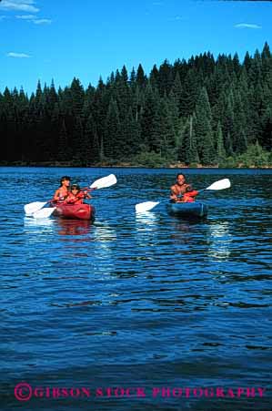 Stock Photo #2540: keywords - boat child children family father kayak lake mother paddle parent quiet recreation released sport summer together vacation vert water