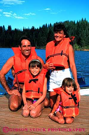 Stock Photo #2541: keywords -  boating child children family father float flotation mother orange parent recreation released safety together vert vest water
